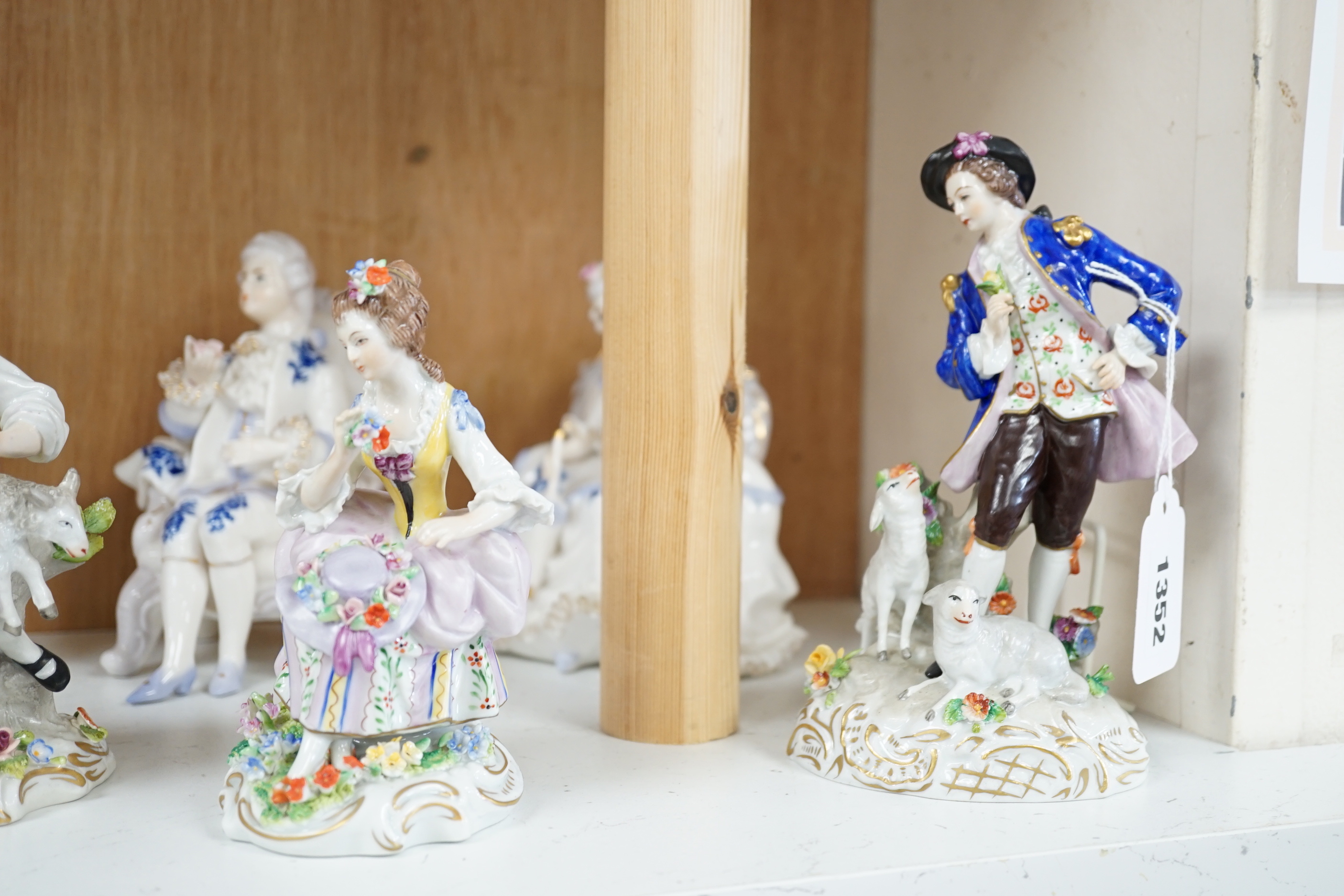 A quantity of porcelain figures and groups including eight Sitzendorf examples and Royal Doulton Marie, HN1635, the largest 19cm high